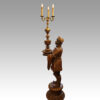 Large pair of blackamoor Walnut candelabra side