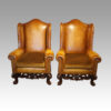 Pair of leather William and Mary wing chairs
