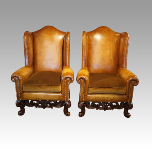 Pair of leather William and Mary wing chairs