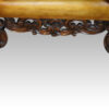 Pair of leather William and Mary wing chairs carving