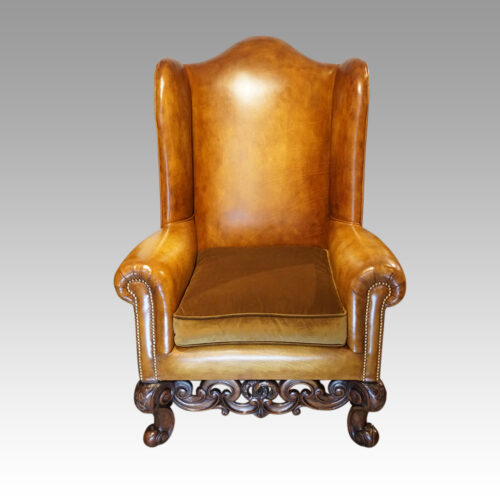 Pair of leather William and Mary wing chairs front