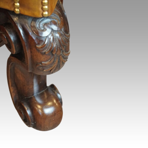 Pair of leather William and Mary wing chairs front leg