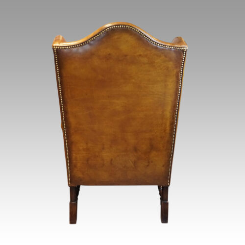 Pair of leather William and Mary wing chairs rear