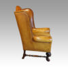 Pair of leather William and Mary wing chairs side