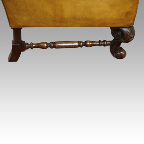 Pair of leather William and Mary wing chairs turned stretcher