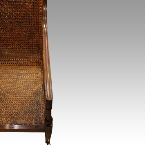Antique mahogany bergere library chair arm