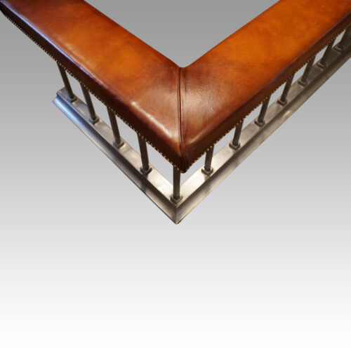 Brushed steel and tan leather club fender corner
