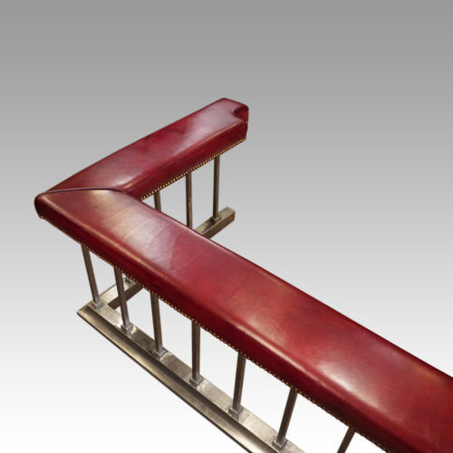 Steel and red leather club fender at angle