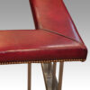 Steel and red leather club fender corner edge