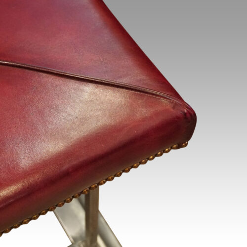 Steel and red leather club fender leather fold