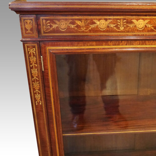 Edwardian inlaid mahogany glazed bookcase top corner