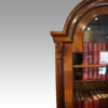 Queen Anne style walnut domed bureau bookcase top corner