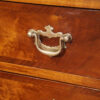Tall walnut chest handle detail