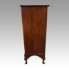 Tall walnut chest side view