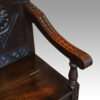 Victorian carved oak settle arm