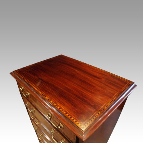 Edwardian tall narrow mahogany chest top