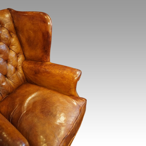 Leather button back wingchair arm