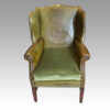 Edwardian green leather wing chair