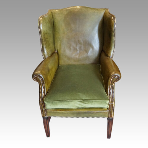 Edwardian green leather wing chair