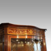 Edwardian serpentine inlaid display cabinet side cornice
