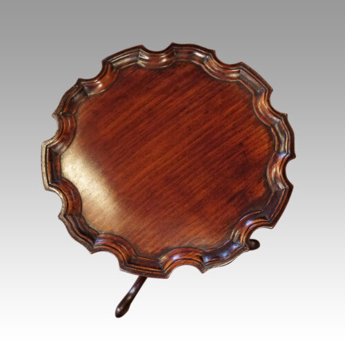 Pair of mahogany wine tables detail top