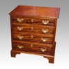 Small Georgian style chest of drawers at angle