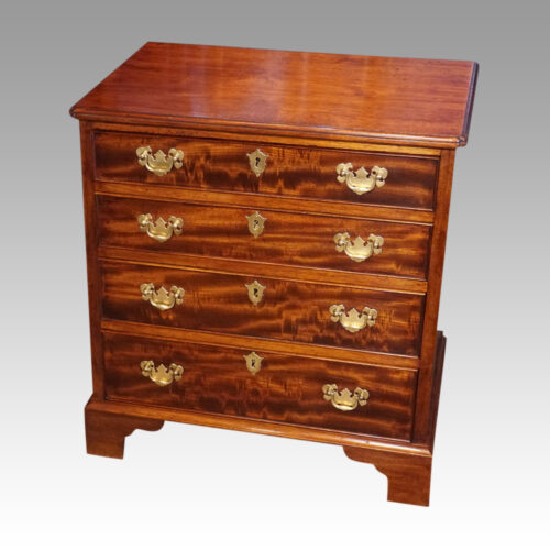 Small Georgian style chest of drawers at angle