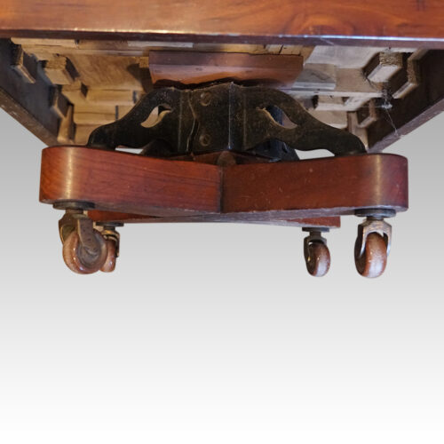 Edwardian walnut revolving bookcase cast iron base