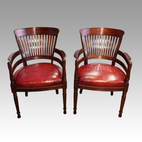 Pair of Edwardian mahogany desk chairs