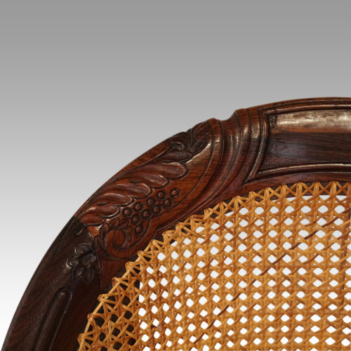 Regency bergere chair carving on back