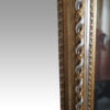 19thc. gilt pier mirror with eglomise glass panel running rope pattern
