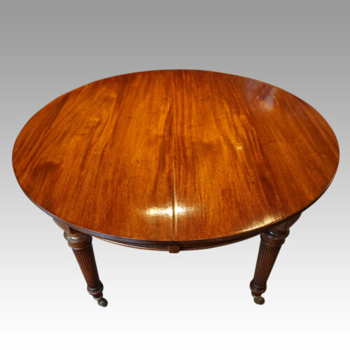 Edwardian circular extending dining table closed