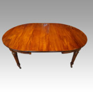 Edwardian circular extending dining table one leaf