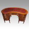 Edwardian inlaid mahogany kidney shaped desk angle top
