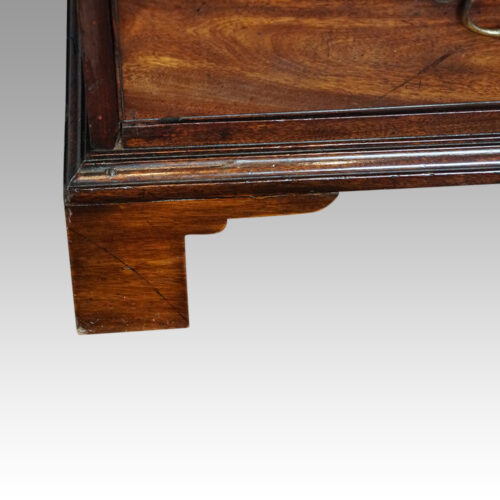 George III mahogany bureau bracket foot