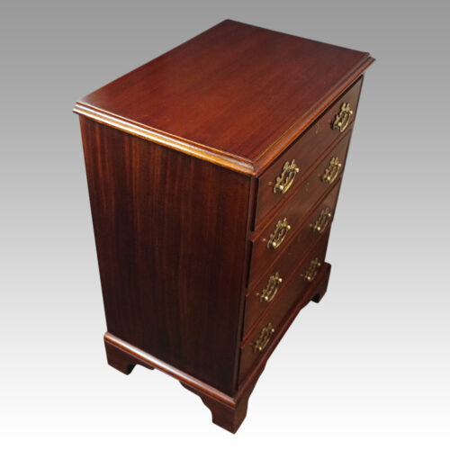 Pair of mahogany bedside chests angle