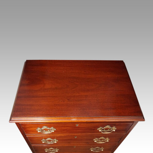 Pair of mahogany bedside chests top detail