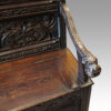 Victorian carved oak settle arm