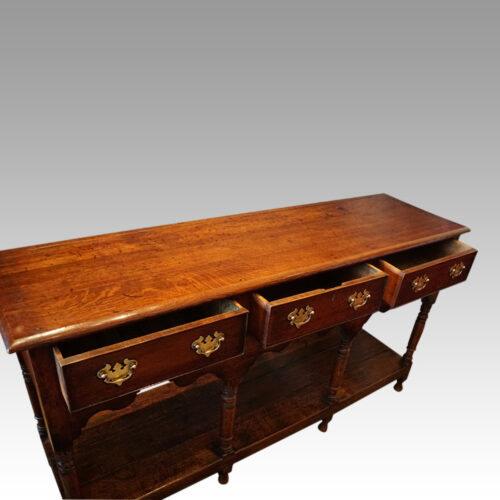 Antique oak dresser base at angle