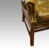 Georgian style leather button back wing chair arm