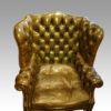 Georgian style leather button back wing chair detail