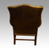 Georgian style leather button back wing chair rear view