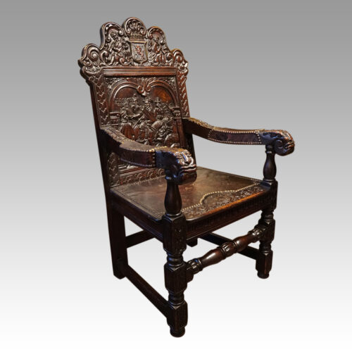 Victorian carved oak throne chair at angle