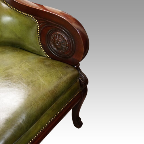 Antique leather library chair arm detail