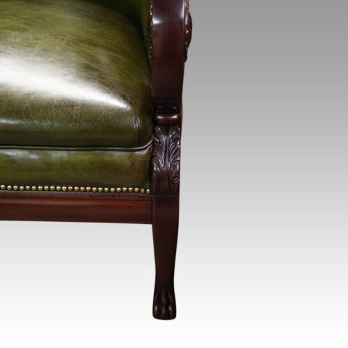 Antique leather library chair front leg