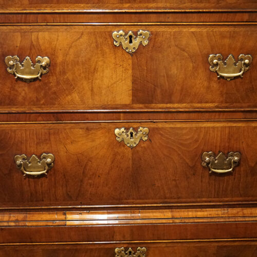 George III walnut chest on chest drawer fronts