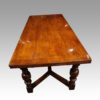 Large oak extending refectory table end view