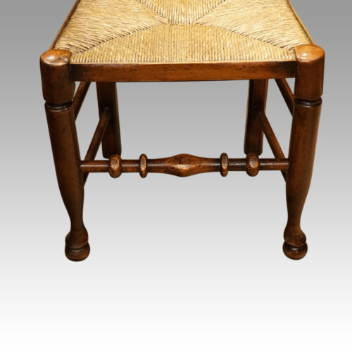 Set of 10 Lancashire spindle back chairs front legs