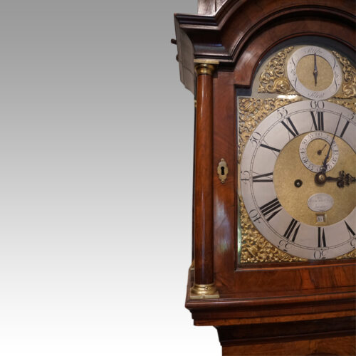 George II walnut longcase clock by Bentley London hood pillar