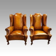 Pair of Edwardian leather wing chairs